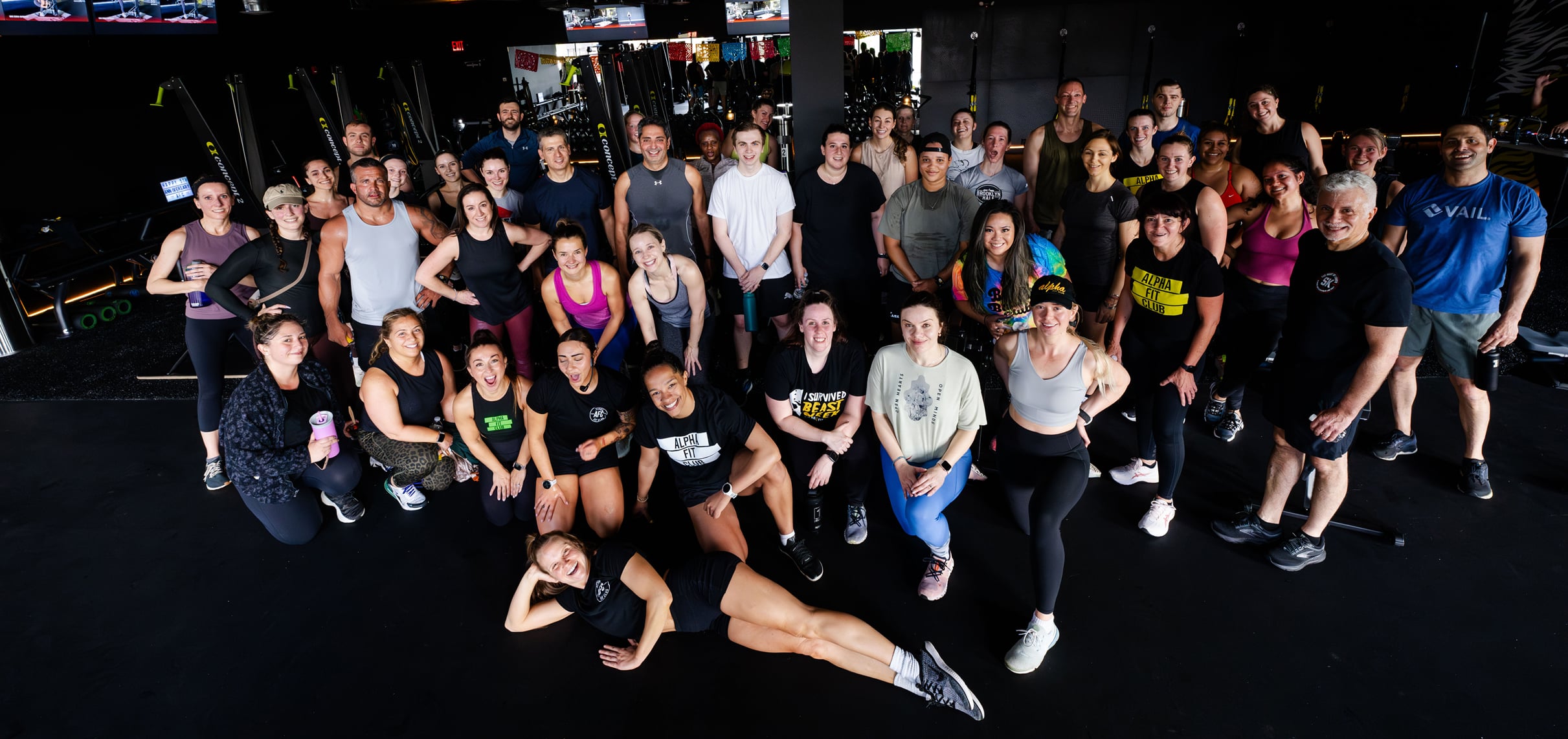 A Group photo of fit, smiling gymnasts at an Alpha Fit gym.